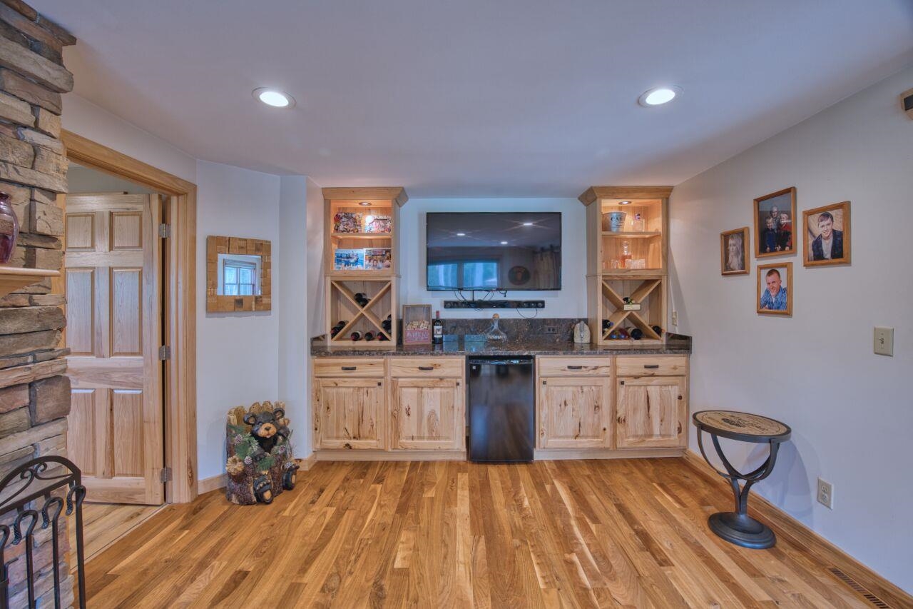 3557 Haverkamp Road Hibbing, MN 55746 - Photo 23 of 60 Indoor wet bar with light wood finished floors, dishwasher, and recessed lighting
