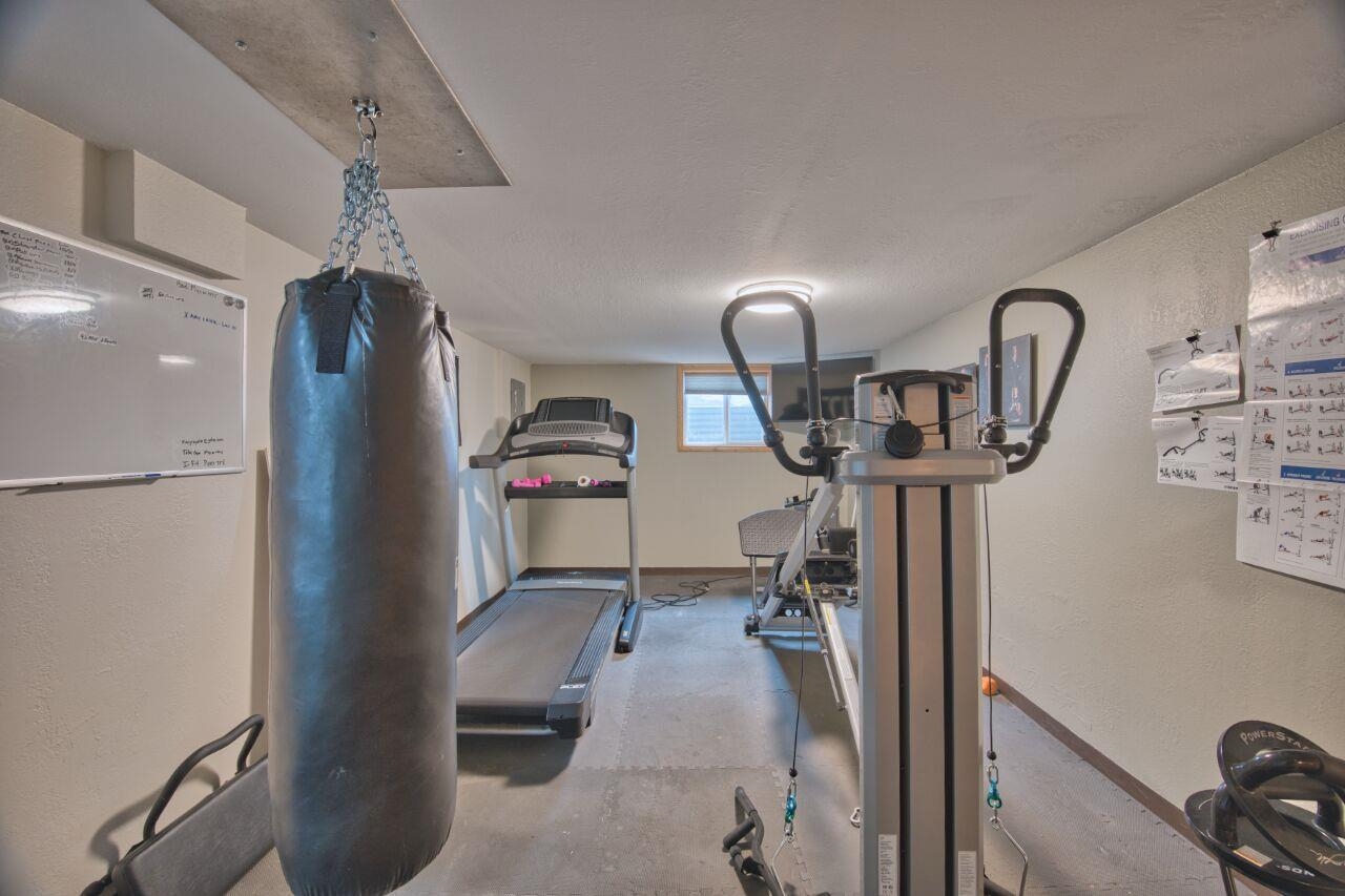 3557 Haverkamp Road Hibbing, MN 55746 - Photo 38 of 60 Workout room featuring baseboards and a textured wall