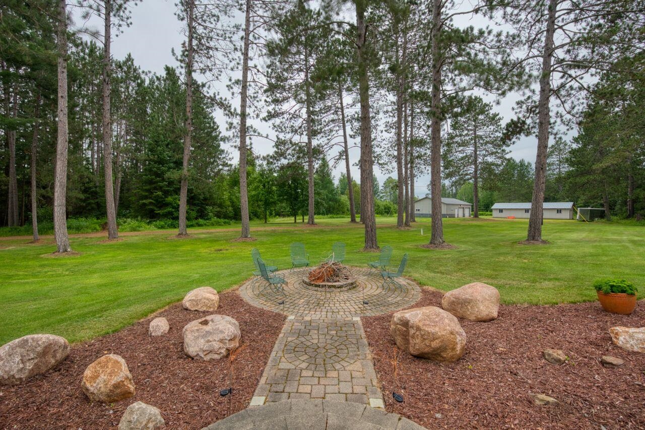 3557 Haverkamp Road Hibbing, MN 55746 - Photo 57 of 60 View of grassy yard with a fire pit