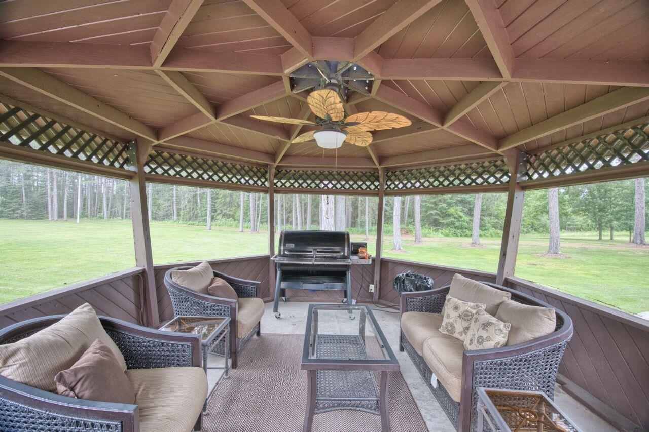 3557 Haverkamp Road Hibbing, MN 55746 - Photo 58 of 60 Sunroom with an outdoor hangout area and a ceiling fan