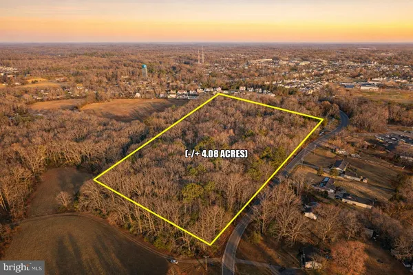an aerial view of house with yard