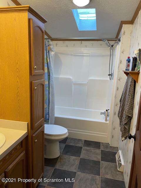 4014 State Rte 92 Nicholson, PA 18446 - Photo 11 of 17 a bathroom with a sink a toilet and a shower