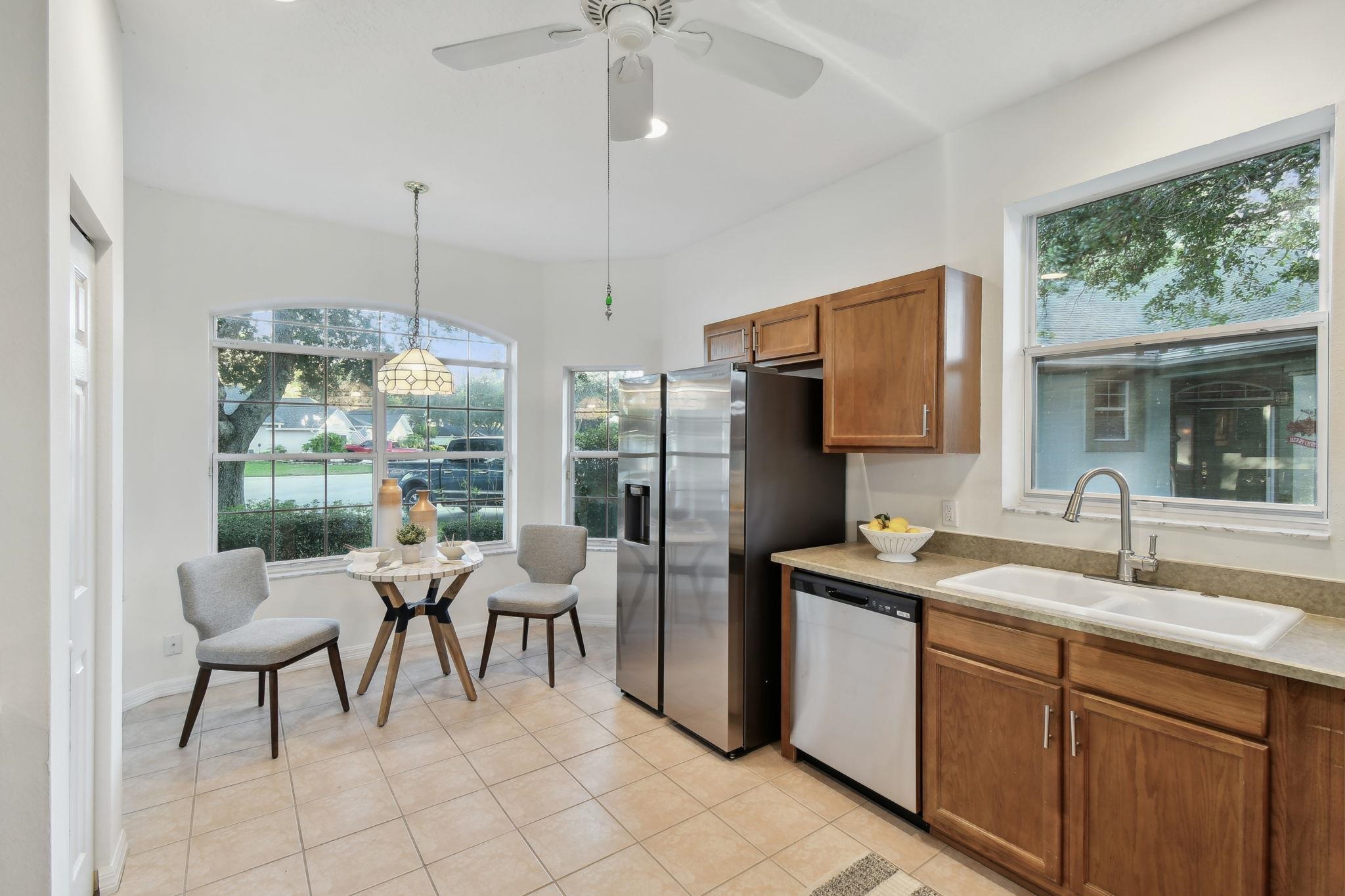 581 Boxwood Place St. Augustine, FL 32086 - Photo 11 of 44 a open kitchen with stainless steel appliances granite countertop a sink and a refrigerator