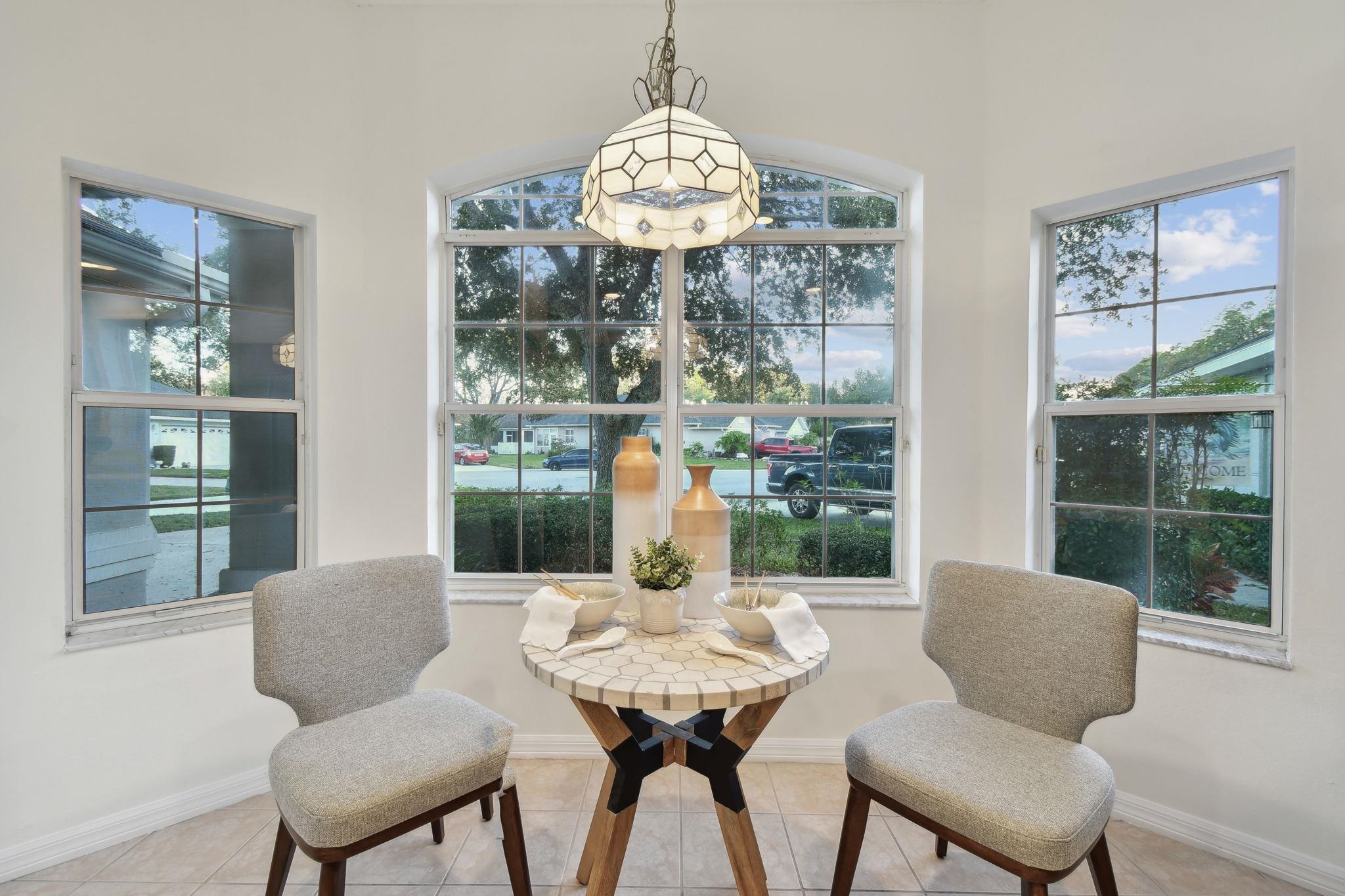 581 Boxwood Place St. Augustine, FL 32086 - Photo 13 of 44 a view of a dining room with furniture window and outside view