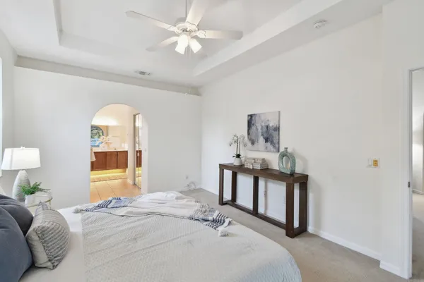 a white toilet sitting next to a bathroom