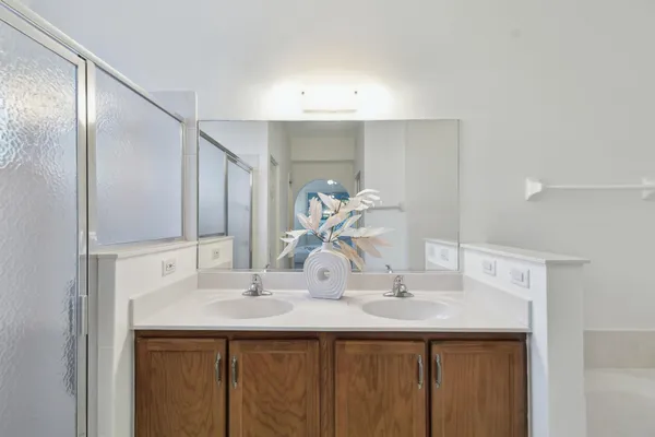 a view of an empty room and bathroom