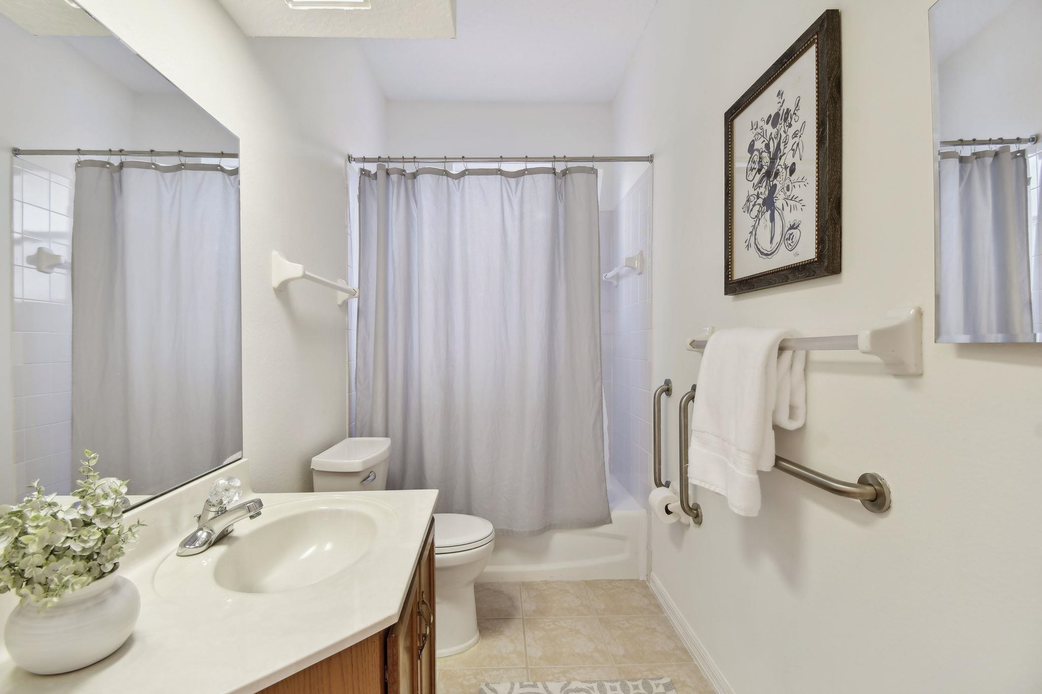 581 Boxwood Place St. Augustine, FL 32086 - Photo 29 of 44 a bathroom with a sink vanity and tub