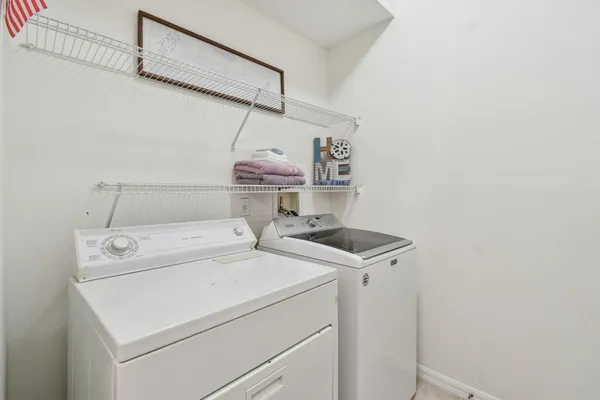 an aerial view of residential houses with outdoor space and street view