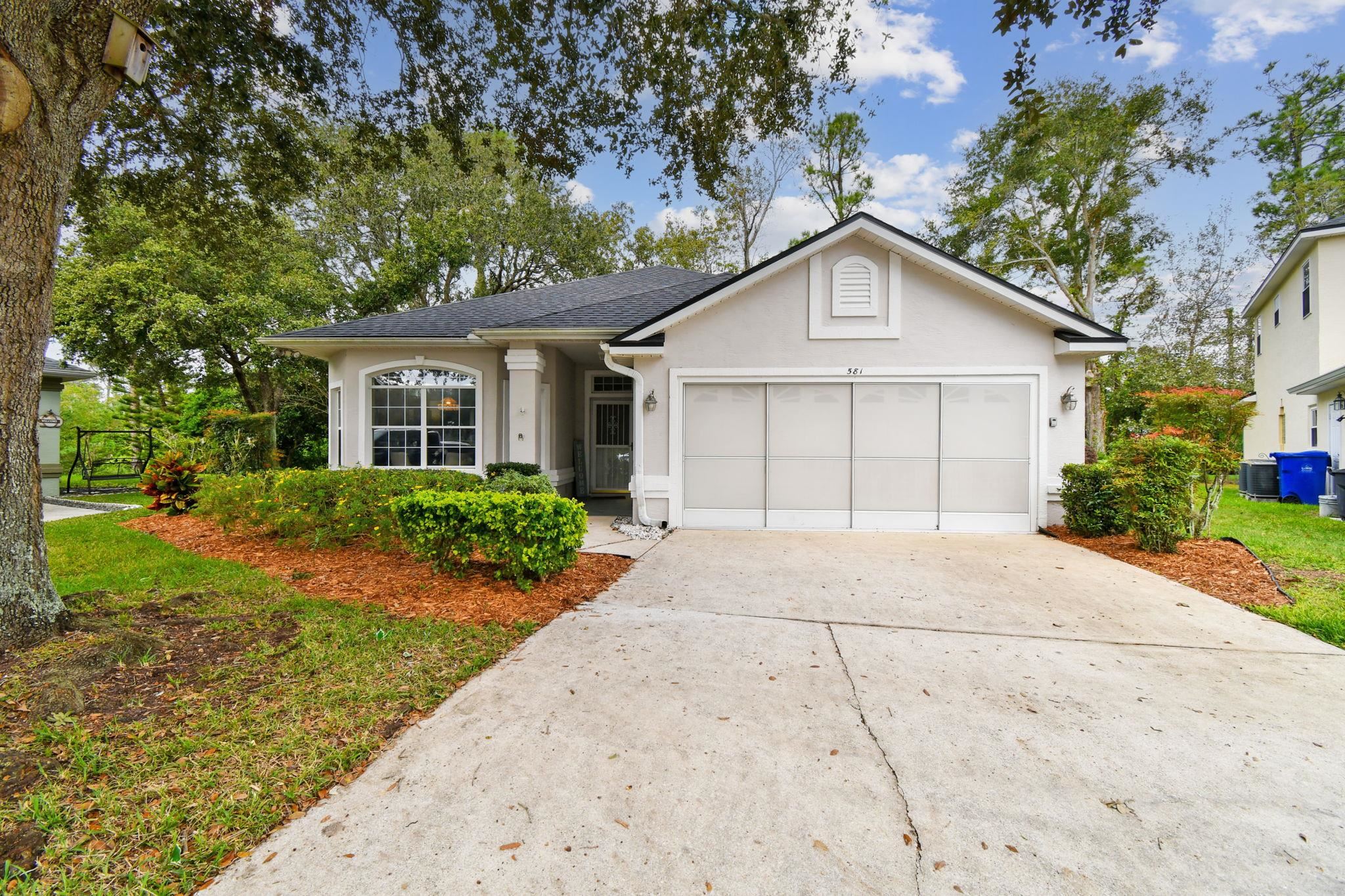 581 Boxwood Place St. Augustine, FL 32086 - Photo 34 of 44 front view of a house with a yard