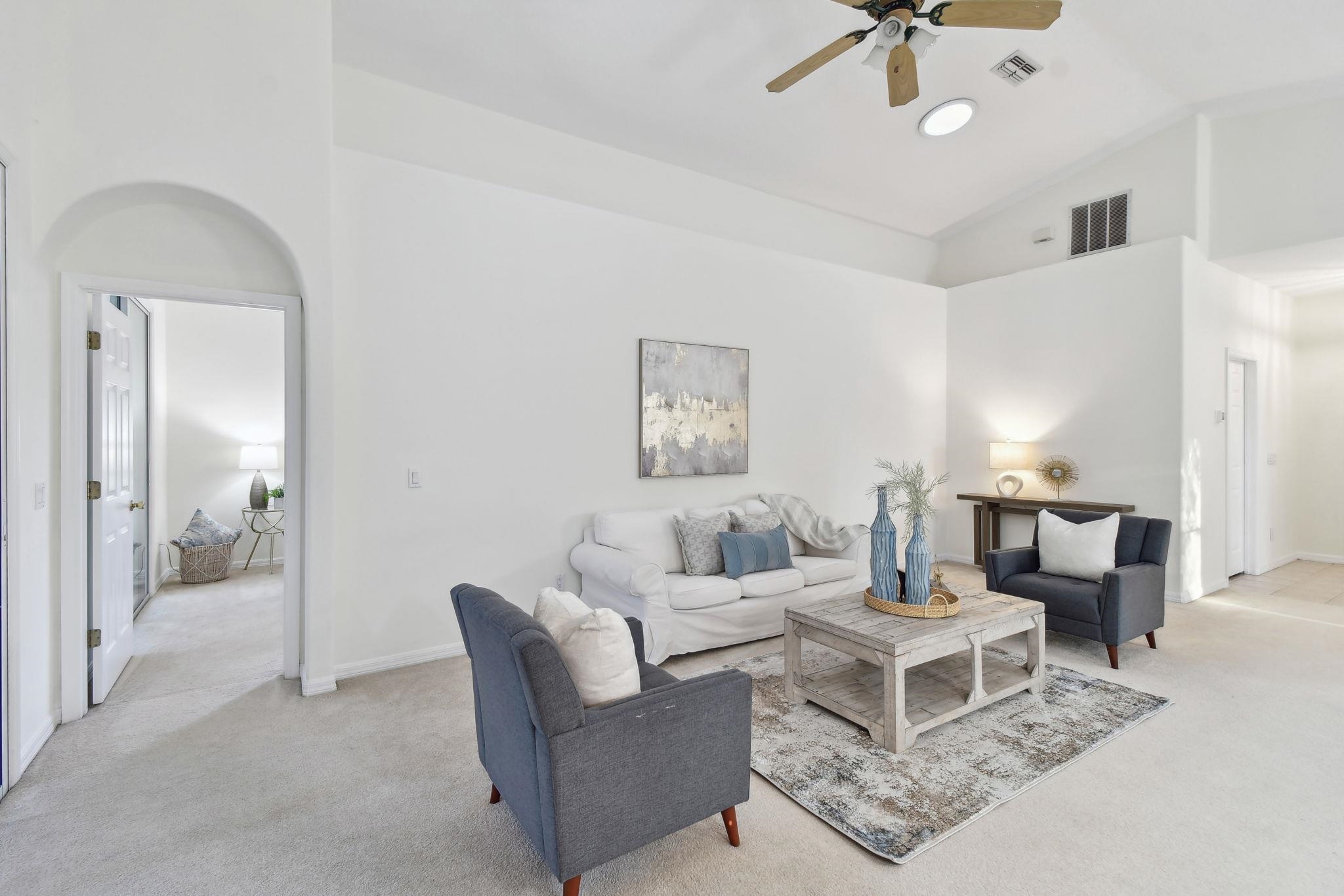 581 Boxwood Place St. Augustine, FL 32086 - Photo 5 of 44 a living room with furniture and a chandelier