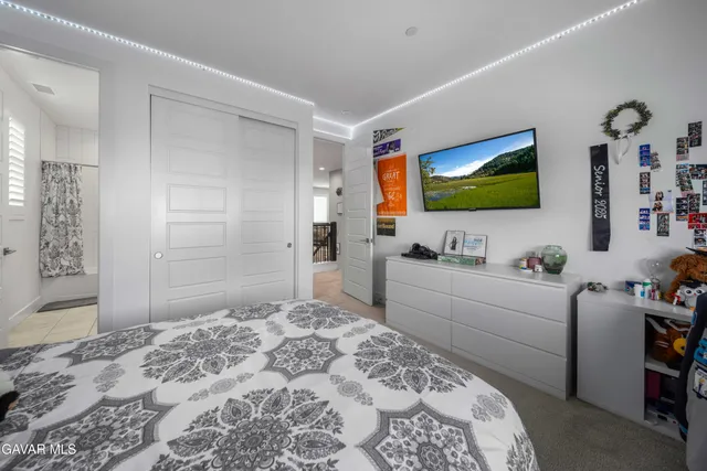 a bathroom with a tub sink shower and mirror