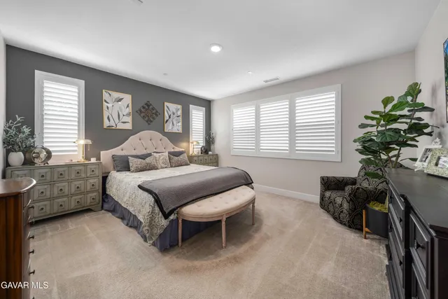 a view of an outdoor dining space with furniture and outdoor kitchen
