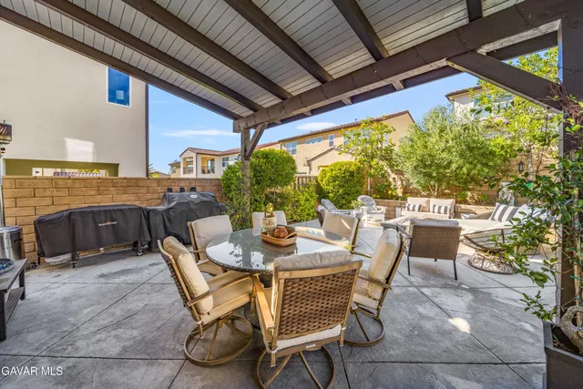 an aerial view of a house with a garden and deck