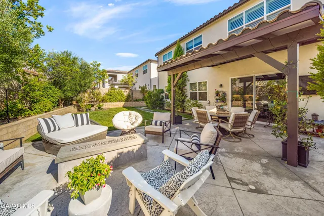 an aerial view of a house with a garden and swimming pool