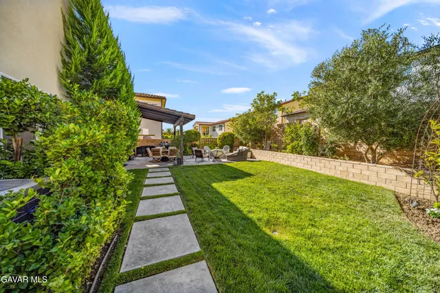 an aerial view of residential houses with a street view