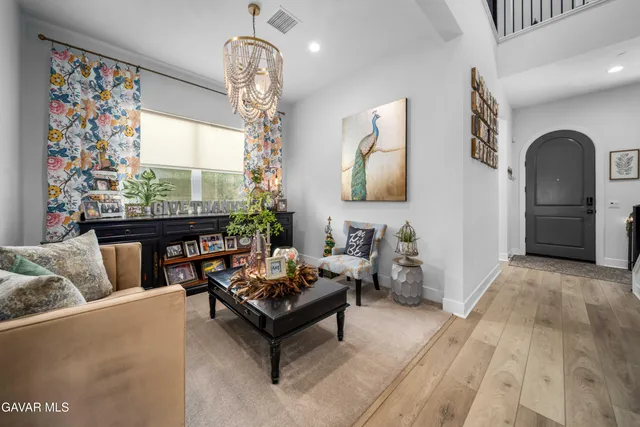a hallway with a couch and a potted plant