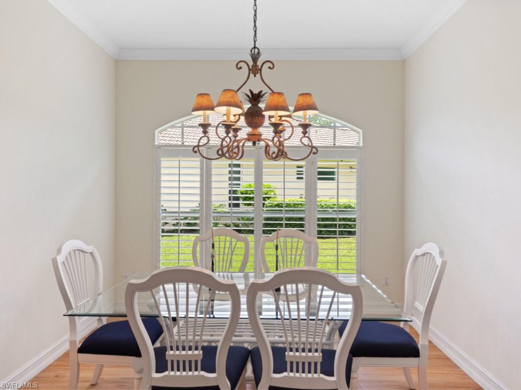 6840 Bent Grass Drive Naples, FL 34113 - Photo 4 of 21 a view of a dining room with furniture window and outside view