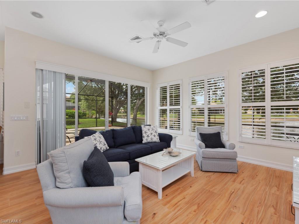 6840 Bent Grass Drive Naples, FL 34113 - Photo 7 of 21 a living room with furniture and a large window
