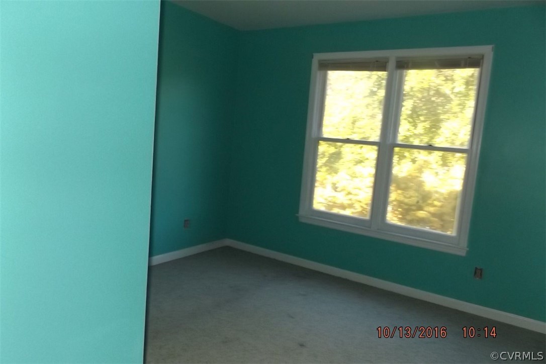 11101 Timonium Drive Chester, VA 23831 - Photo 7 of 18 a view of an empty room with a window