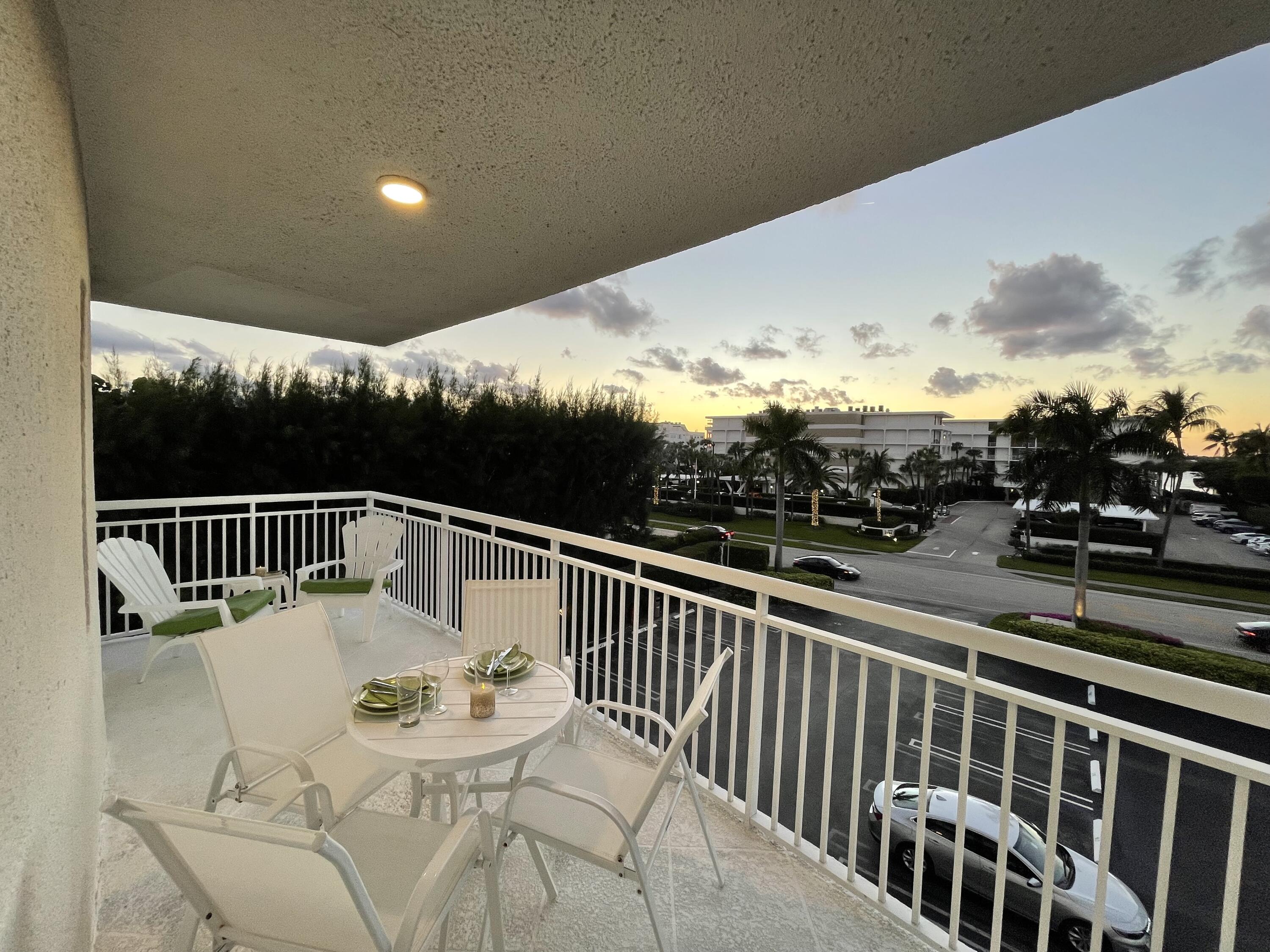 2780 South Ocean Boulevard, Unit 312 Palm Beach, FL 33480 - Photo 16 of 29 a balcony with table and chairs