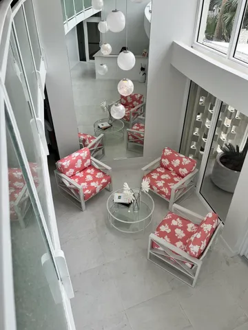 a living room with furniture and rug floor