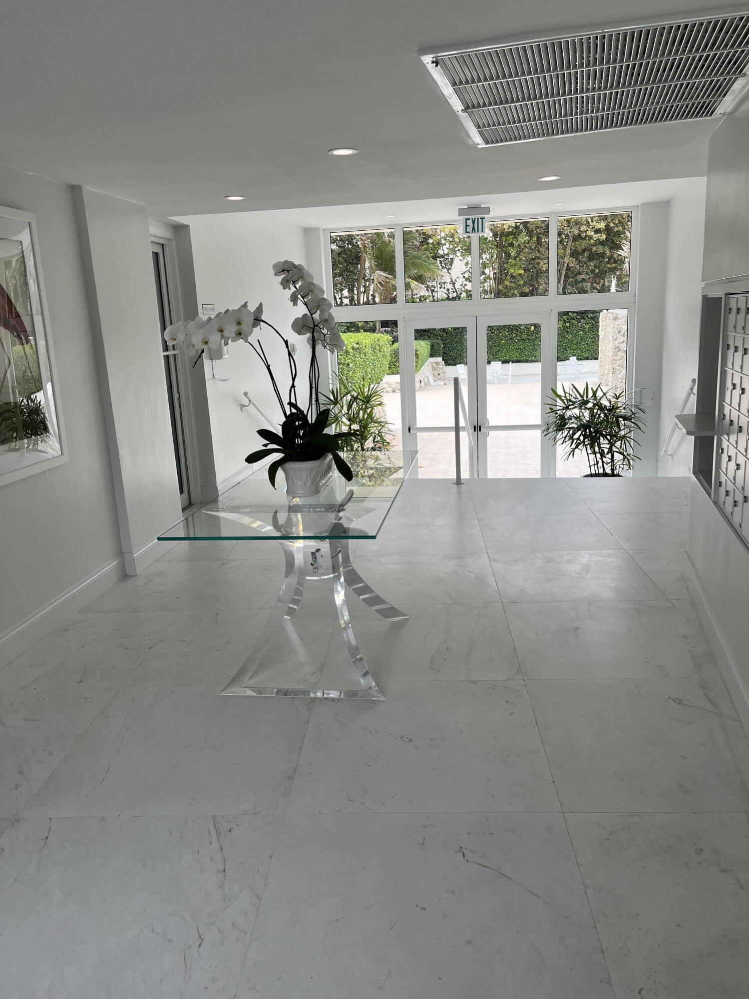 2780 South Ocean Boulevard, Unit 312 Palm Beach, FL 33480 - Photo 22 of 29 a view of a livingroom with furniture and floor to ceiling window