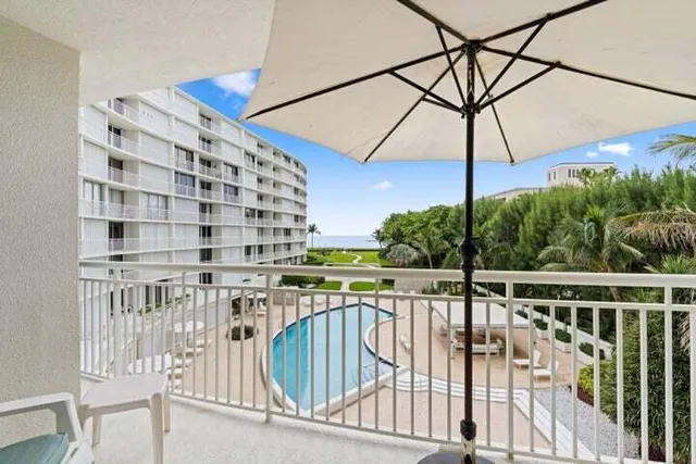 a view of a balcony with a potted plant