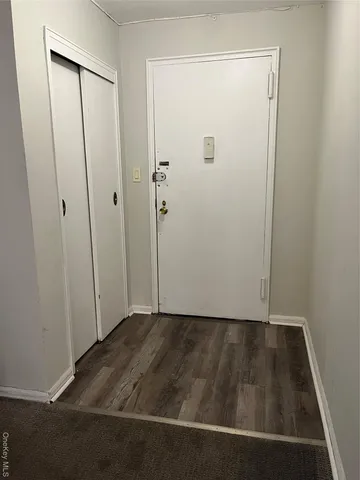 an empty room with wooden floor