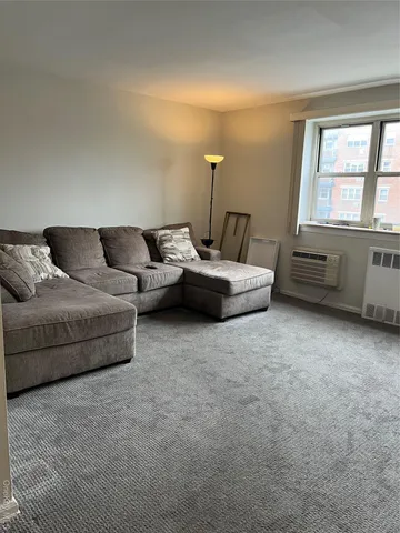 a living room with furniture and window
