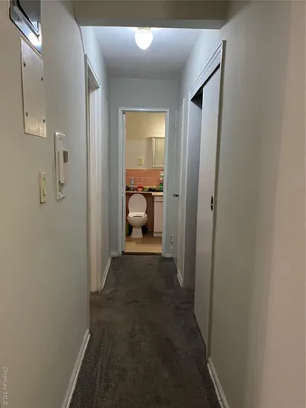 a view of a bathroom from a hallway