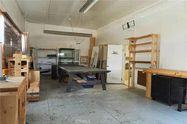 a living room with furniture a dining table and kitchen view