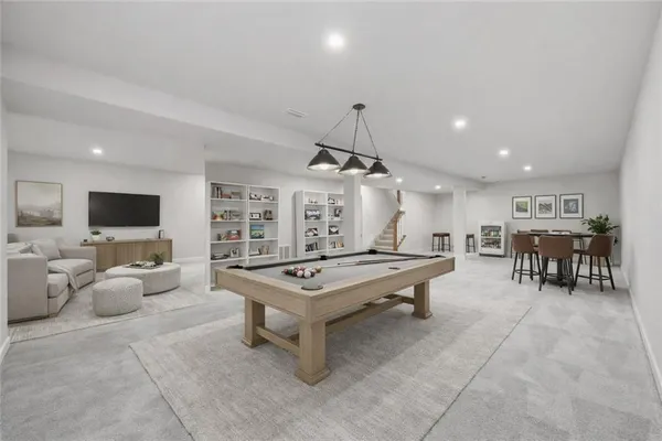a living room with furniture a table and chairs