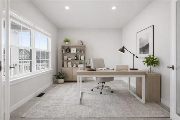 a living room with furniture and a potted plant