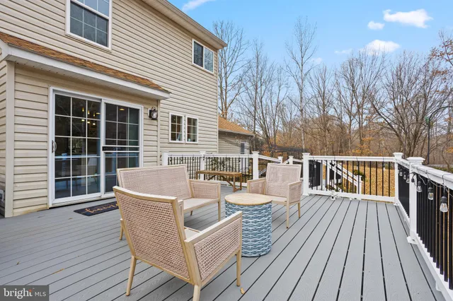 a view of a house with wooden deck