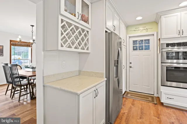a view of kitchen with furniture and wooden floor