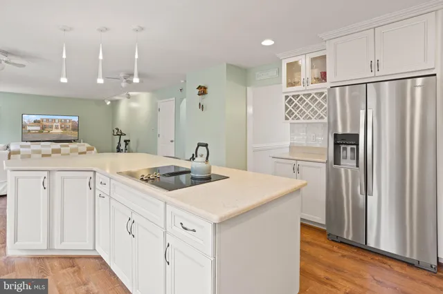 a kitchen with a sink stove and refrigerator