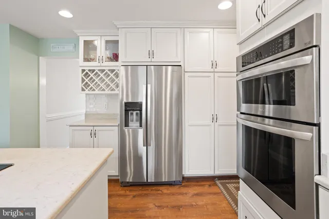a kitchen with stainless steel appliances a refrigerator stove and microwave
