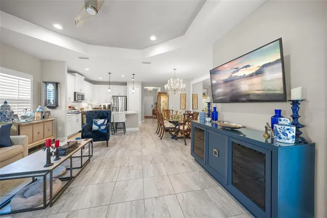 a spacious bedroom with a bed and ceiling fan