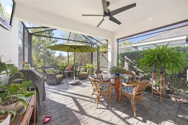 a view of an outdoor sitting area with furniture and backyard
