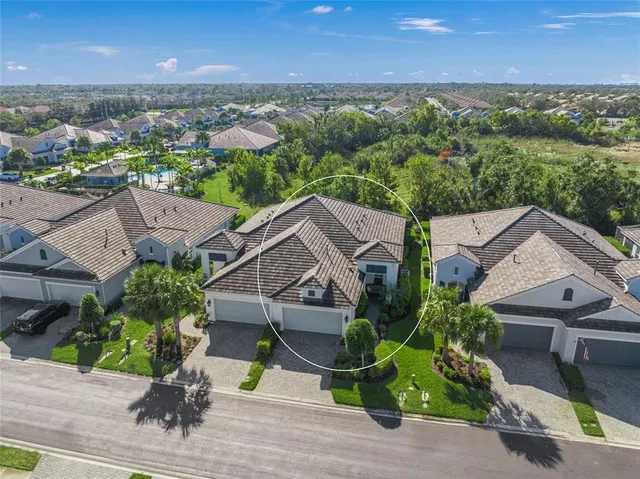 an aerial view of houses with yard