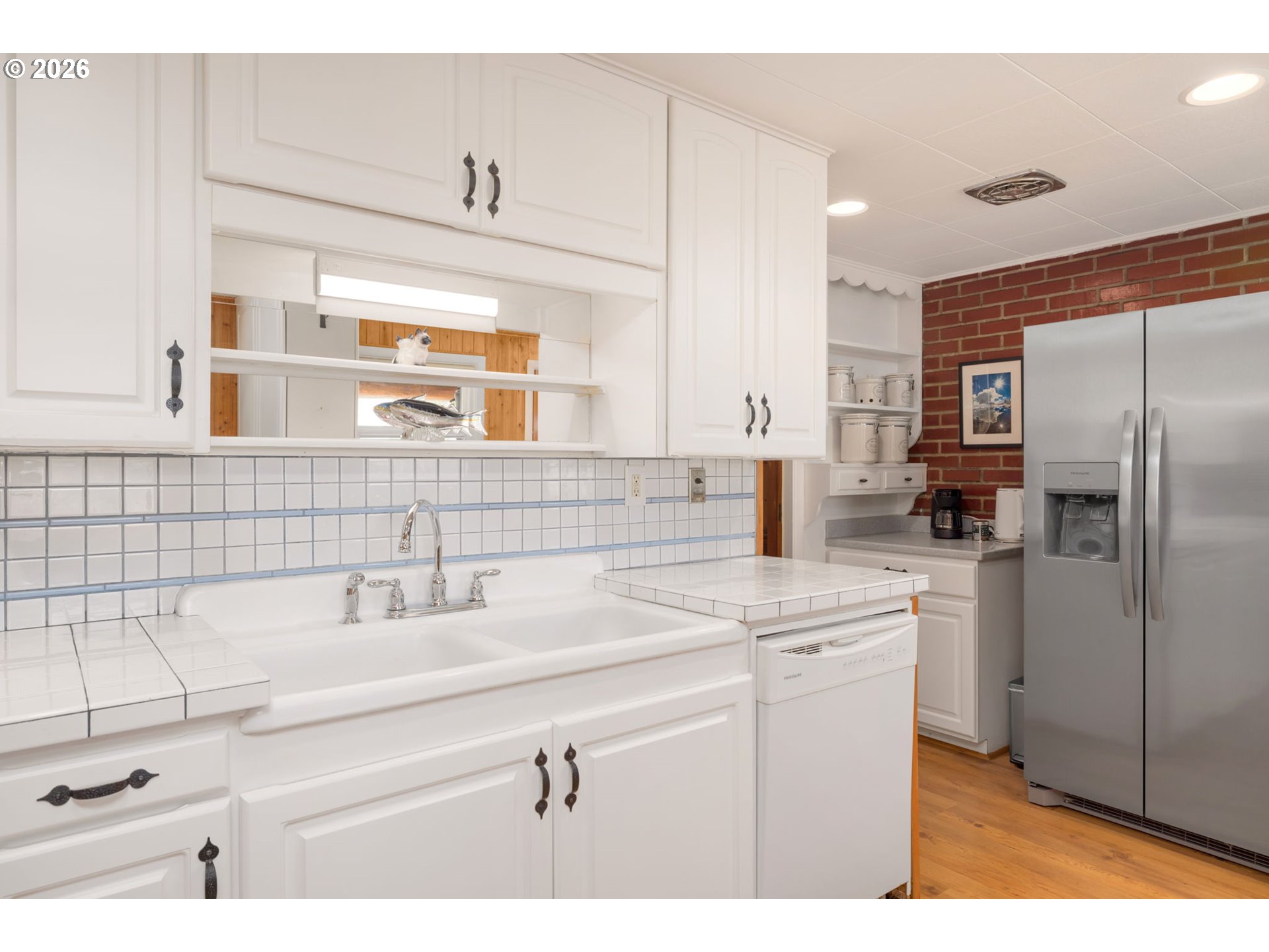15880 Southeast Bluff Road Sandy, OR 97055 - Photo 19 of 47 a kitchen with a sink refrigerator and cabinets