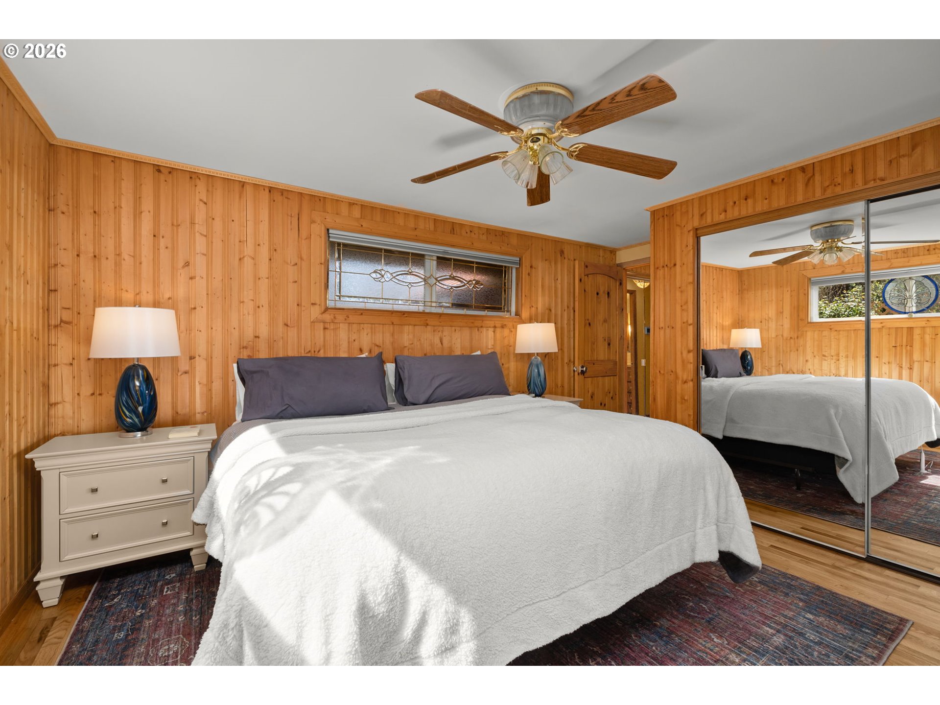 15880 Southeast Bluff Road Sandy, OR 97055 - Photo 23 of 47 a bedroom with a large bed and a chandelier