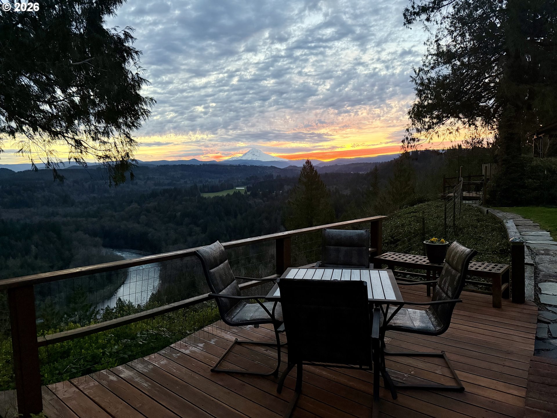 15880 Southeast Bluff Road Sandy, OR 97055 - Photo 5 of 47 a view of a roof deck with table and chairs with wooden floor and fence