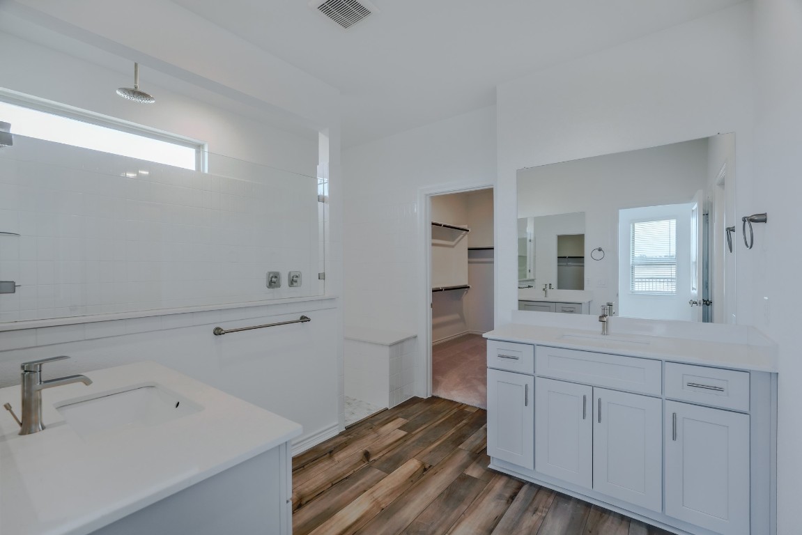 15135 Wild Gully Way Conroe, TX 77302 - Photo 13 of 42 a en suite bathroom with a sink and mirror