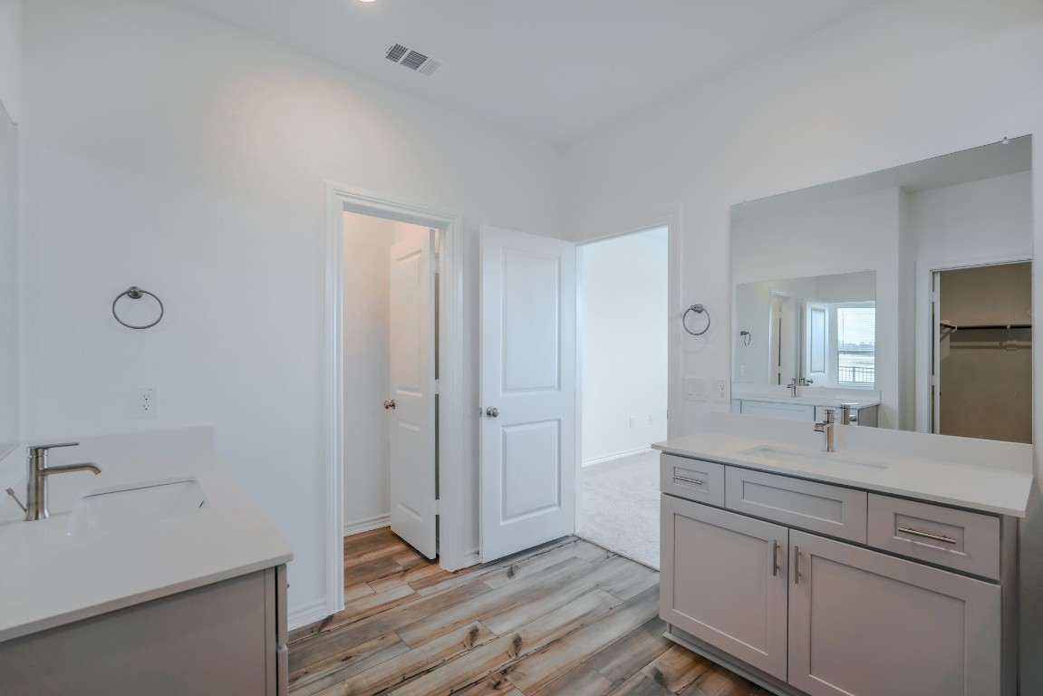15135 Wild Gully Way Conroe, TX 77302 - Photo 14 of 42 a bathroom with a sink and a mirror