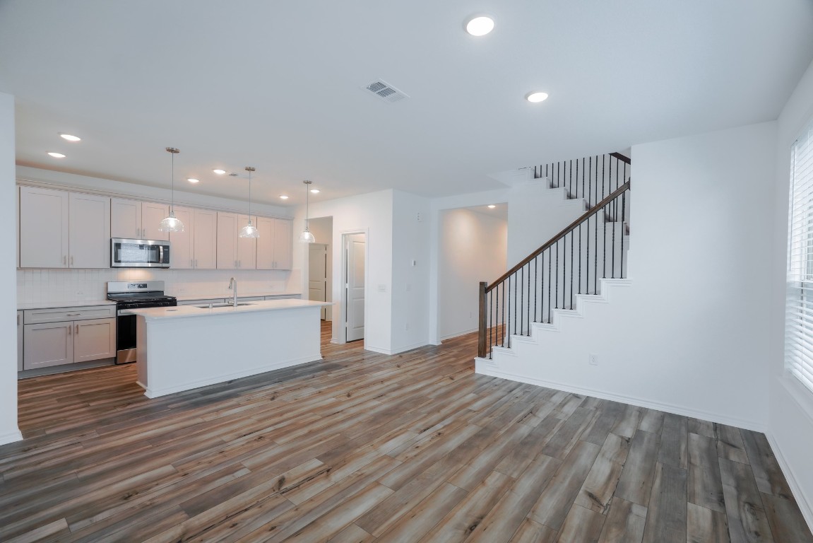 15135 Wild Gully Way Conroe, TX 77302 - Photo 19 of 42 a view of kitchen with wooden floor and electronic appliances