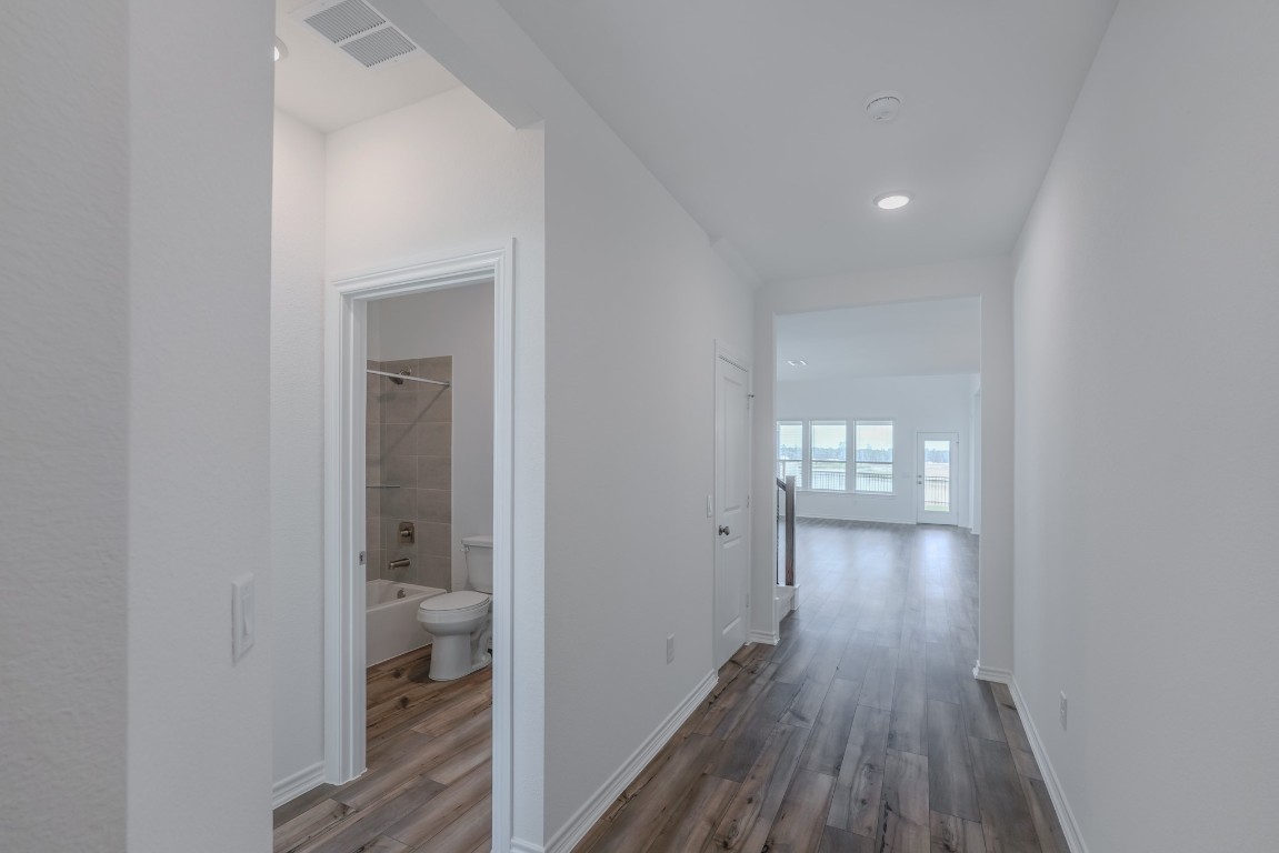 15135 Wild Gully Way Conroe, TX 77302 - Photo 2 of 42 a bathroom with a sink and a toilet