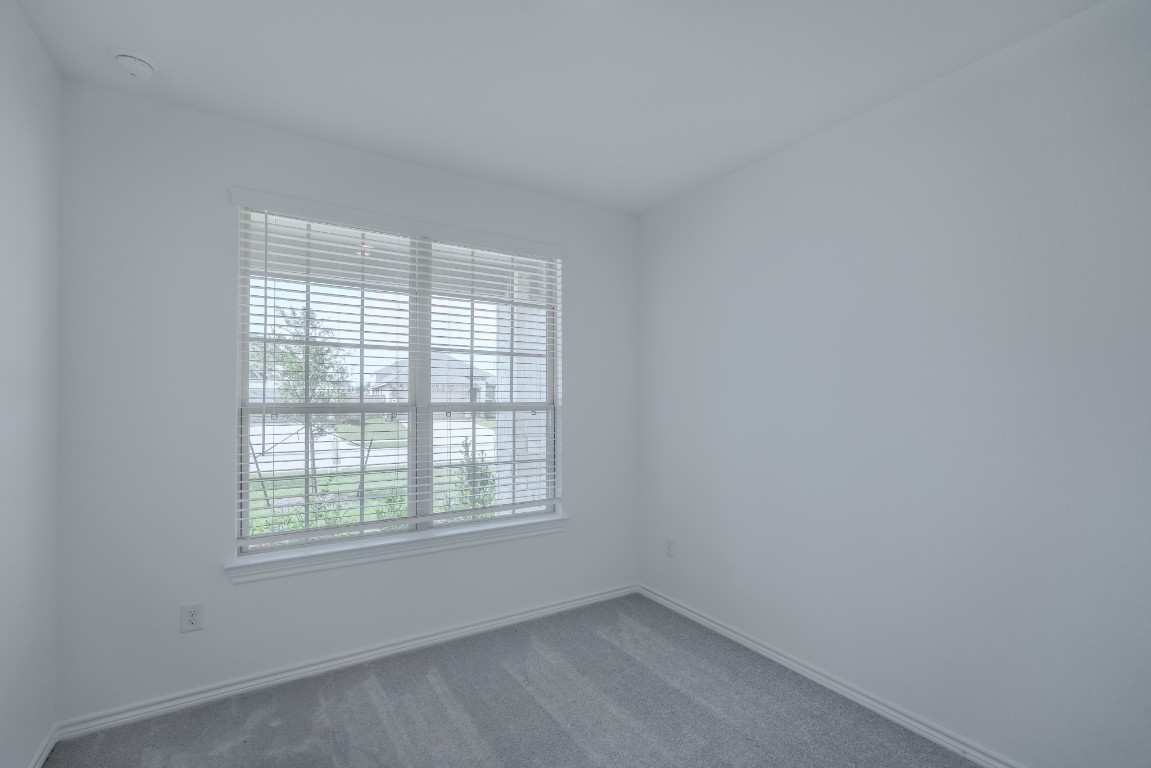 15135 Wild Gully Way Conroe, TX 77302 - Photo 22 of 42 an empty room with a window