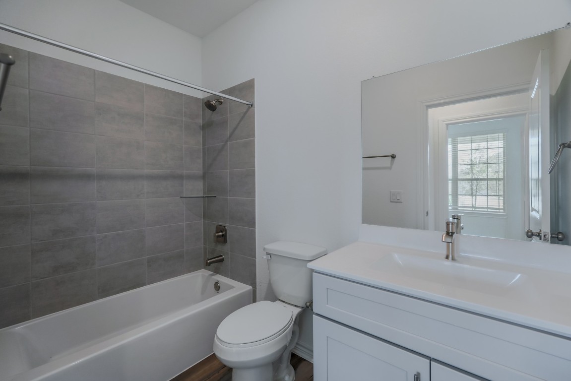 15135 Wild Gully Way Conroe, TX 77302 - Photo 23 of 42 a bathroom with a sink toilet and shower