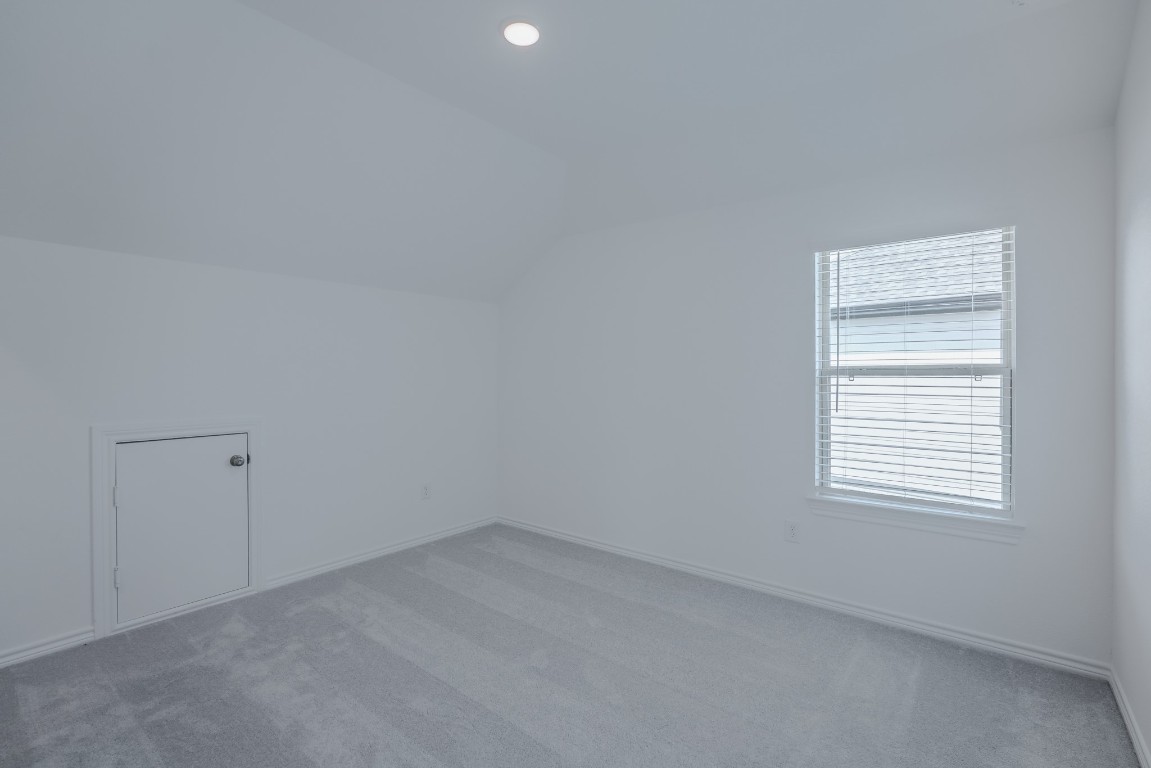 15135 Wild Gully Way Conroe, TX 77302 - Photo 27 of 42 an empty room with a window